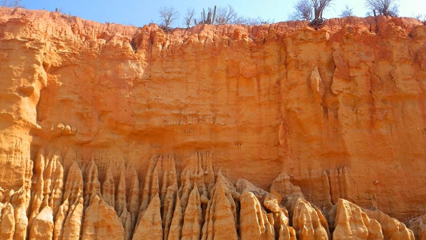 Rock formation of different strata form artworks of color