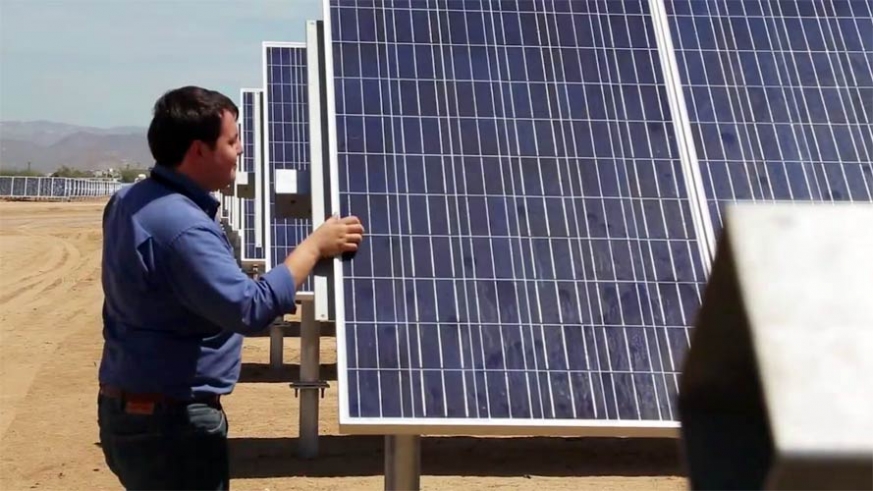 Engineer checking the final installation of the solar array