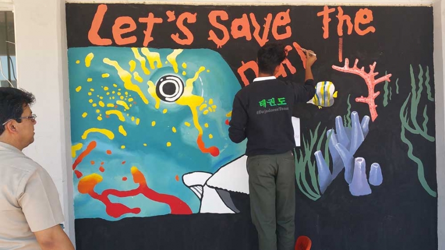 Students painted a mural to illustrate the importance of protecting the parrotfish