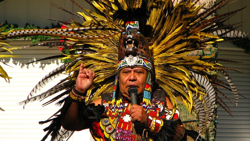 Traditional High Aztec costume with the feathered head dress indicating power or piety